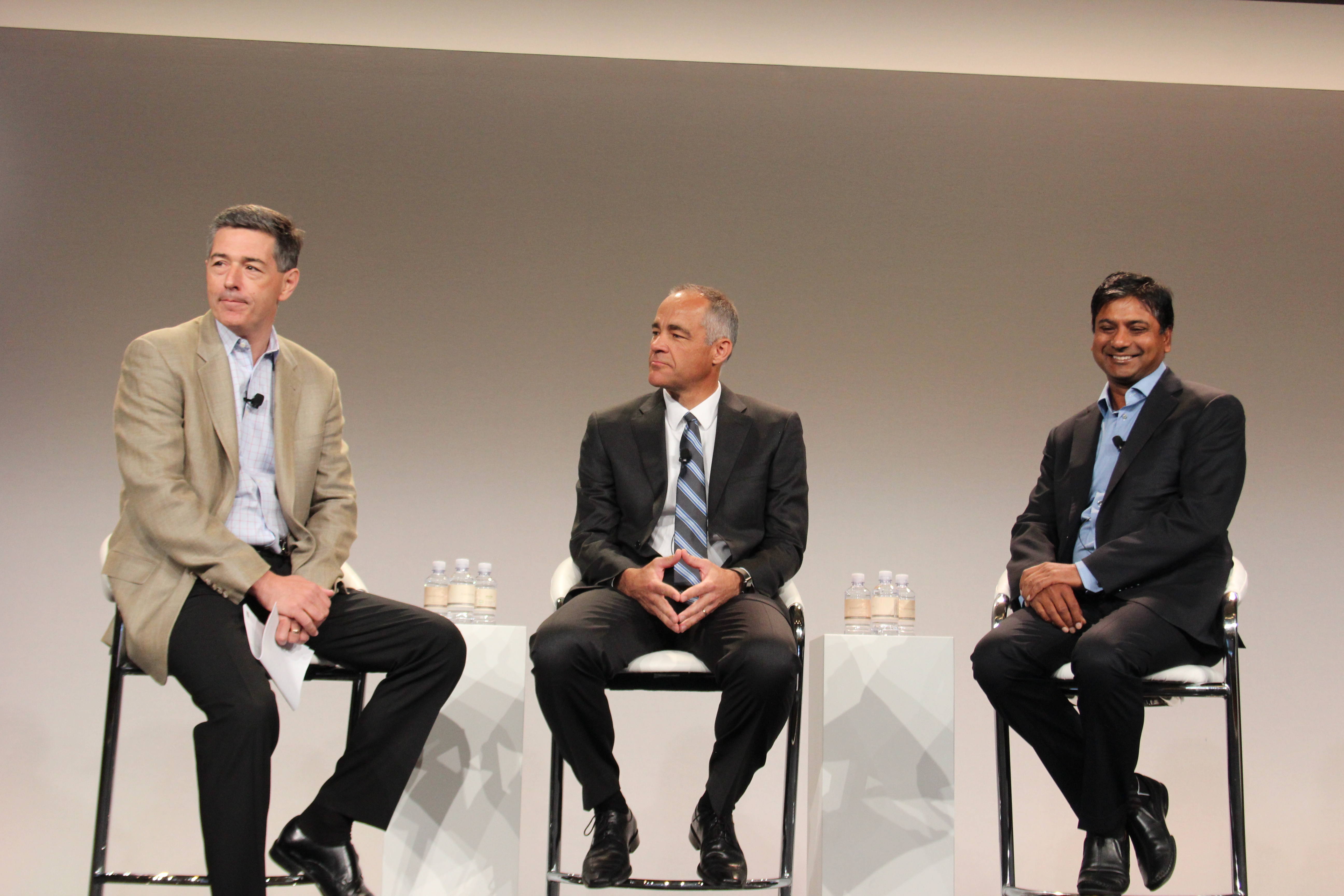 Manish Goel, senior vice president and general manage of storage at HPE [right] and Ric Lewis, senior vice-president and general manager of converged data centre infrastructure [centre] on stage at HPE Discover.