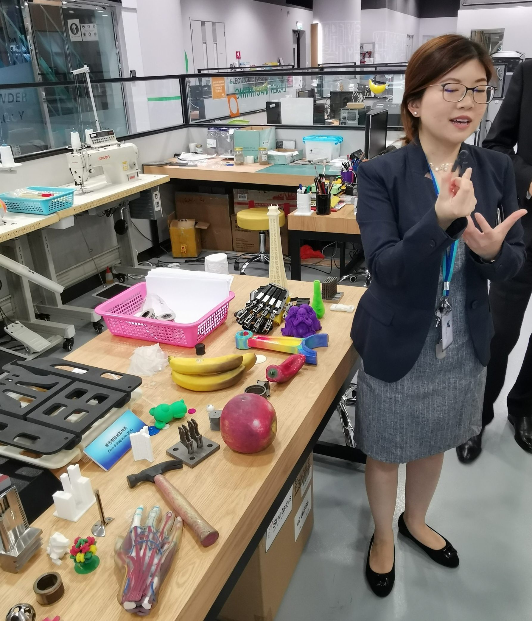 Stephanie Huang, manager of the community innovation unit at HKPC, shows some 3D printed items in a prototyping lab.